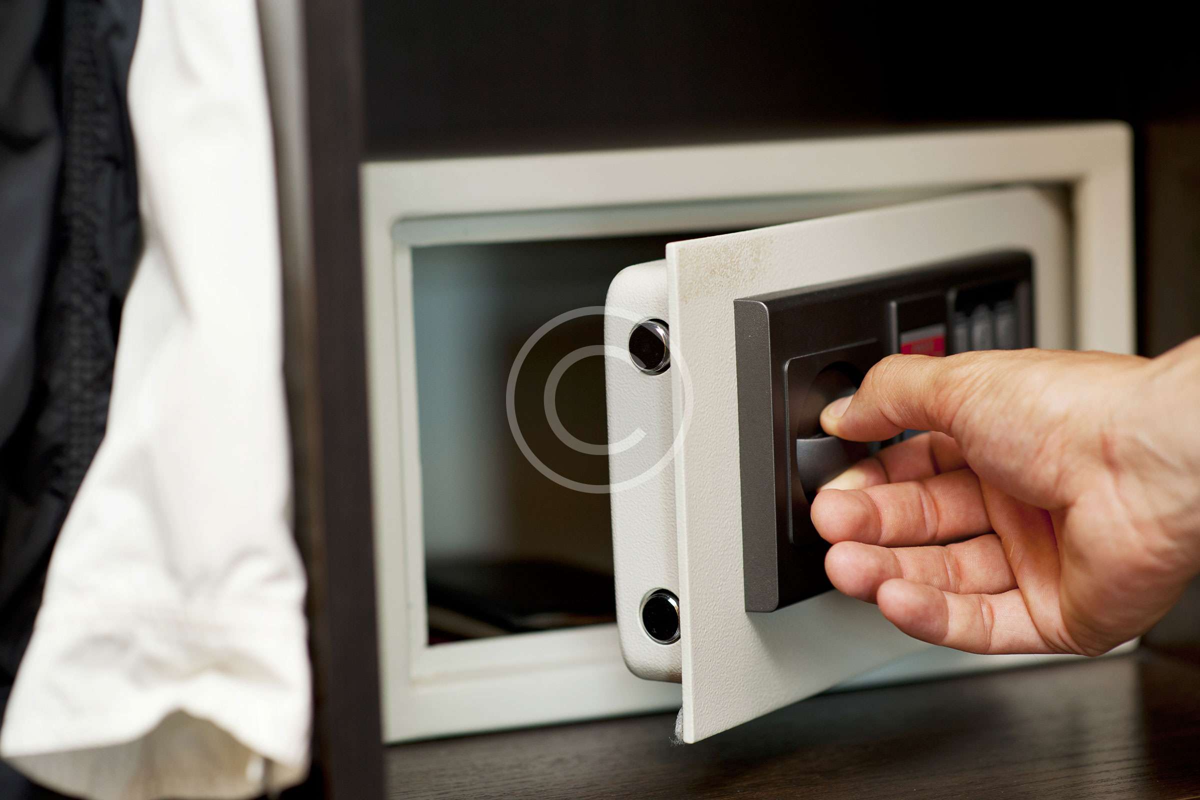 A person opening up an open microwave oven.
